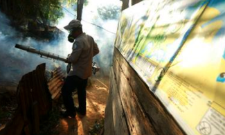 In this Feb. 25, 2016 file photo, a Health Ministry worker fumigates for the Aedes aegypti mosquito, vector for the spread of the Zika virus, in Veracruz, Panama, Thursday, Feb. 25, 2016. The Zika virus will have a significant impact on Latin America and the Caribbean and will disproportionately affect the poorest communities, widening economic inequality in the region, the United Nations said on Thursday, April 6, 2017. Photo: Arnulfo Franco, AP