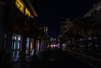 Street lamps are out on a street in the Condado community of Santurce in San Juan, Puerto Rico, on Sept. 19, 2022, after the passage of Hurricane Fiona. (Credit: AFP via Getty Images)