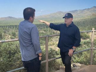 Outside his home in Tucson, Sen. Mark Kelly, D-Ariz., said climate change is "our biggest long-term national security issue."Kailani Koenig / NBC News