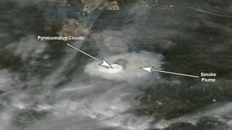 Fort McMurray wildfire smoke plume and pyrocumulus clouds on May 3, 2016. Image: NASA