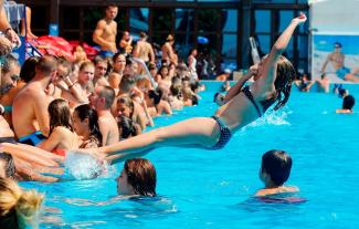 A girl jumps into a public pool in Belgrade to escape temperatures exceeding 100 degrees. Photo: Pedja Milosavljevic, AFP/Getty Images