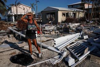 A woman surveys the damage to her mother's house following Hurricane Irma in Big Pine Key, Florida, U.S., September 18, 2017. Photo: Carlo Allegri, Reuters