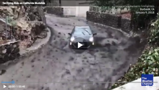 A woman was caught in a mudslide while in her car. It pushed her down a road on a hill, but she survived. Image: The Weather Channel